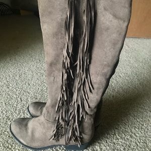 Knee high boots with fringe
